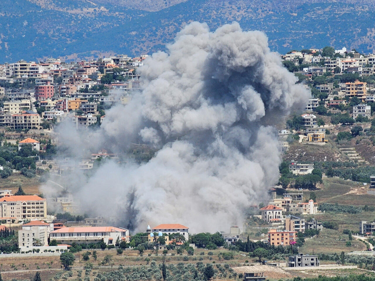 Israeli Airstrike on Hezbollah Arms Depot in Lebanon Injures Eight Amid Ongoing Conflict